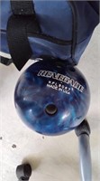 Purple and blue bowling balls in case