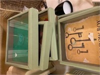 Lot of sage green shadow boxes with glass