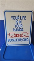 Large metal buckle up sign