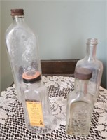 Four vintage apothecary bottles