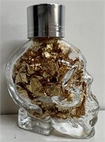 GLASS SKULL FULL OF GOLD FLAKES