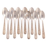 Set of 12 Kirk "Repousse" sterling dessert spoons
