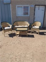 Wicker bench chairs, and table. Some damage to
