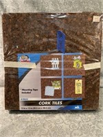 (H) Cork tiles new in plastic. Four packages with