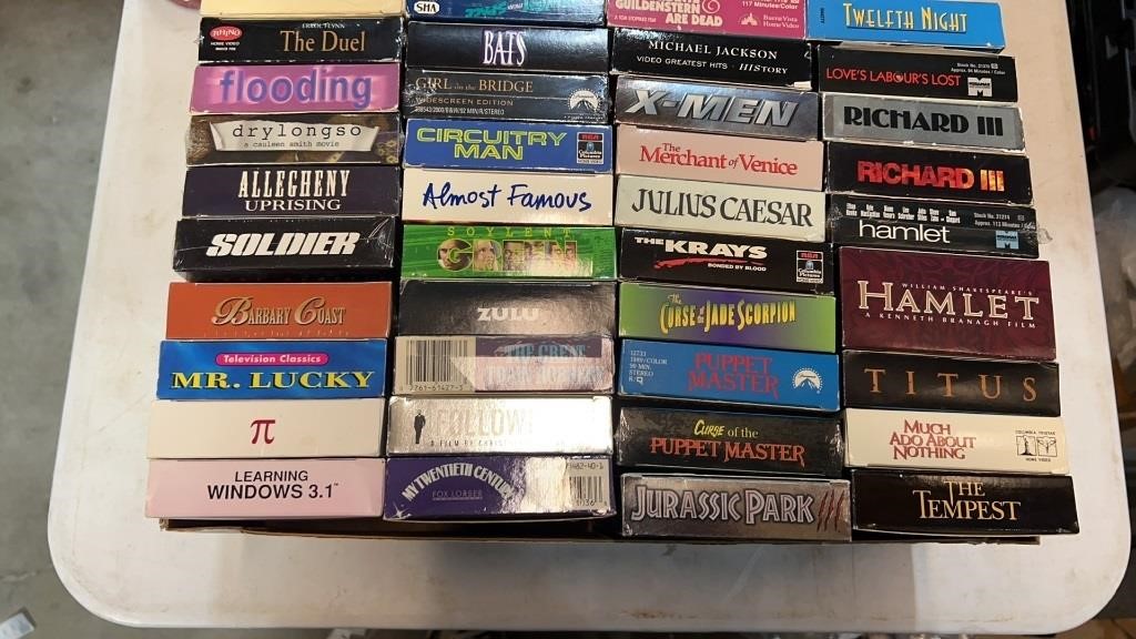 VHS Tape lot with titles like X-men and Puppet