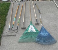 Various garden tools including rakes and hoes.