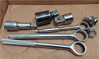 Socket wrenches and sockets.