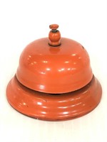 Orange painted metal bell