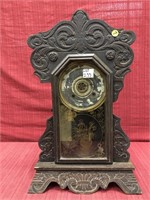 Early oak 8 day mantle clock with stamped foliage