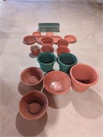 Collection of plastic planters and bases