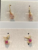Two pair of pierced earrings. Both pink with a