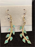 Two pair of pierced earrings. Both with green