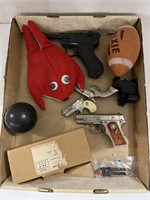 Flat with Toy Guns, Football. Plush Seal and More