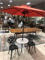 WROUGHT IRON BISTRO TABLE AND 2 WITH UMBRELLA