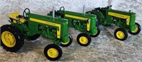 Three John Deere Die Cast Replica Tractors
