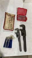 Pipe wrenches, valve guide drivers, etc.