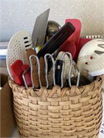 Basket filled with kitchen utensils and more