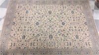 Large beige area rug with blue detail