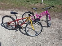 pair of his/hers Schwinn Thrasher mountain bikes