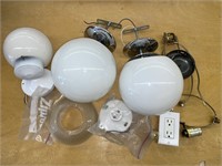 Variety of light fixtures and spare lamp parts.