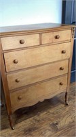 5 drawer wood dresser on wheels, veneer finish,