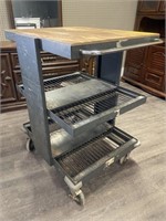 Metal shop cart with Two shelves and a tabletop.