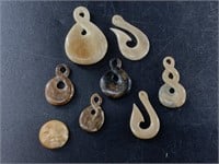 Collection of mammoth ivory pendants and faces all
