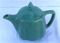 Ceramic teapot with small chip on lid