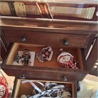 Jewelry box with misc earrings, watches, pins.