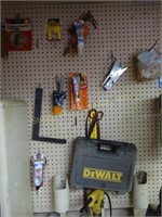 Contents of wall:  DeWalt drill, saws, clamps,