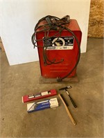 Lincoln AC welder with rods. And tools.
