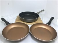 Kitchen helpers kit. Three  frying pans, a