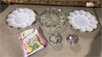 Three vintage deviled egg plates, bag of doilies