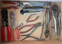 Assortment of pliers, utility knives, wire