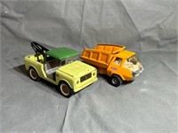 Two metal toy trucks