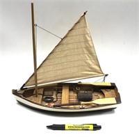 Wooden model row boat with oars, net, flotation