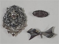 Three sterling silver brooches 44.3g , pb ,