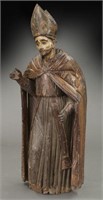 Early carved wood figure of a Bishop Saint,