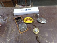 Belt buckles, lighter, plane and Bolo tie