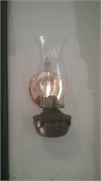 Copper colored wall mount oil lamp