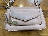 C10)Mauve purse. Has 2 zipper pockets and magnetic