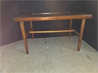 Antique glass topped coffee table