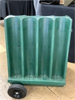 Molded plastic gas station oil can rack.