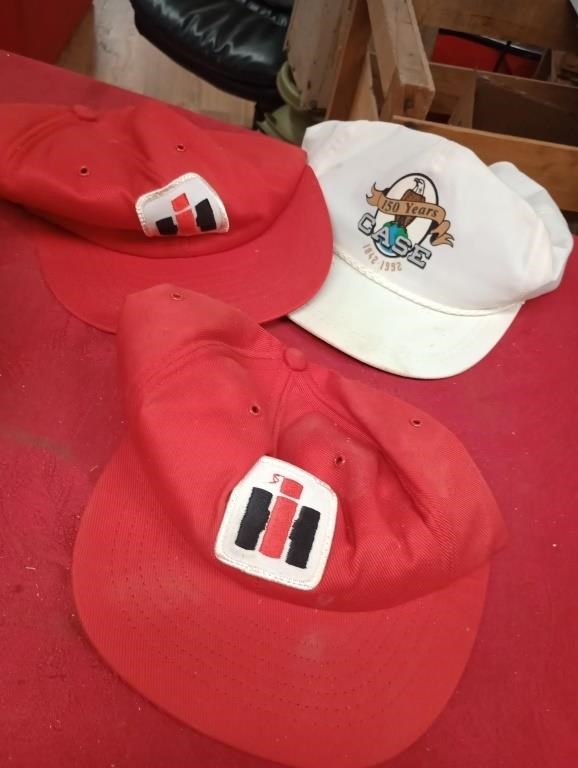 Two international hats and case hat