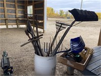 PLASTIC BARREL W/ SHOVELS, RAKES, POST HOLE DIGGER