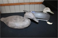 Old wooden goose decoy with raised wing carving