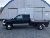 1999 Ford F350 Flatbed Dually Pickup.