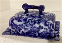 Flow blue look butter dish reproduction with