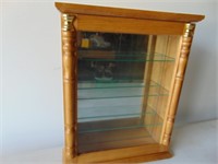 Small curio cabinet with glass shelves