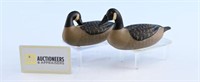 Pair of miniature carved Canada Geese decoys.